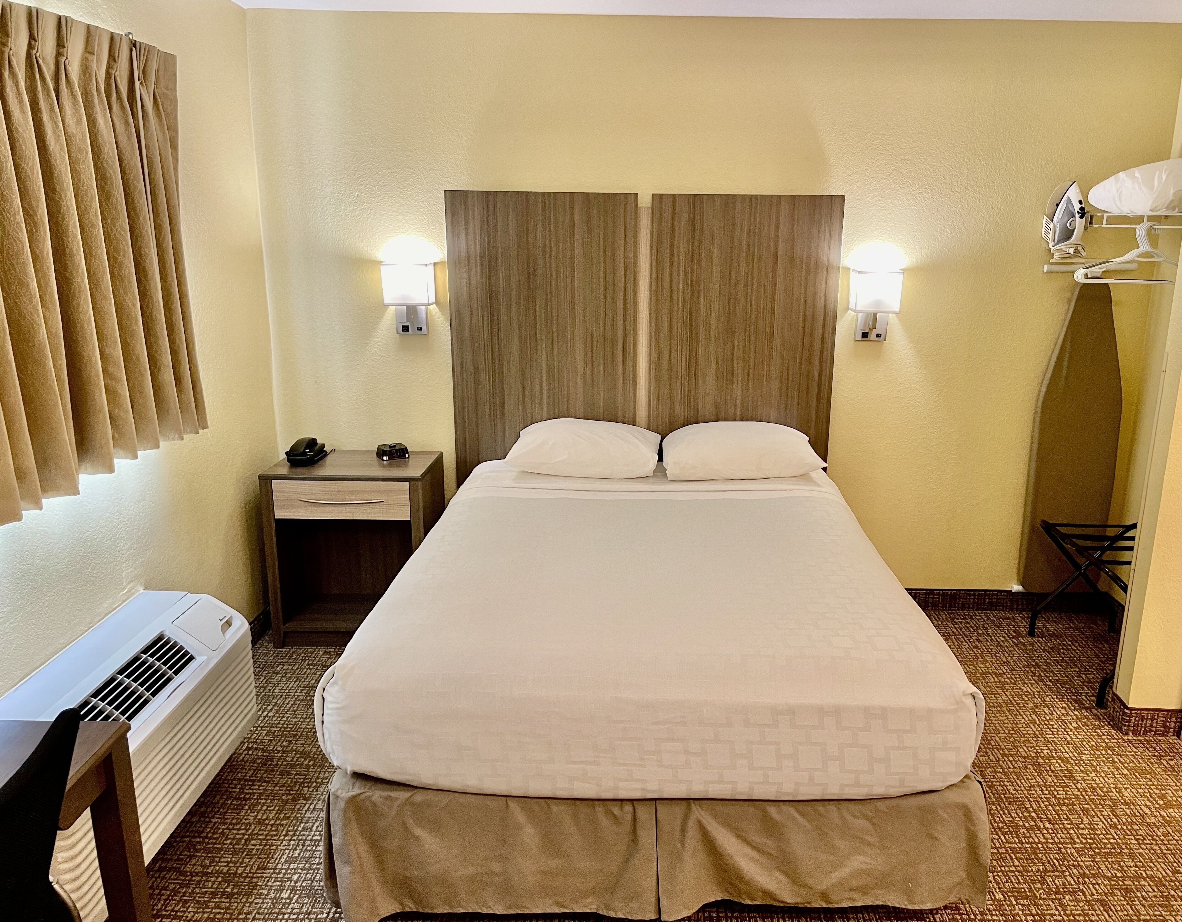Standard Room, 1 Queen Bed, Non Smoking | Blackout curtains, iron/ironing board, free cots/infant beds
