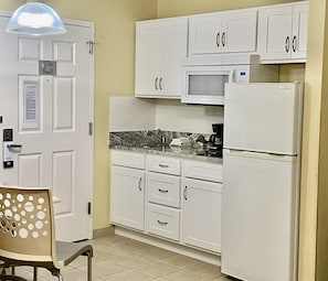 Fridge, microwave, stovetop, coffee/tea maker