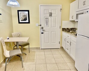 Suite, 1 King Bed, Accessible, Non Smoking (Efficiency) | Private kitchen | Fridge, microwave, stovetop, coffee/tea maker - Suburban Studios Fort Myers Cape Coral (Fort Myers)