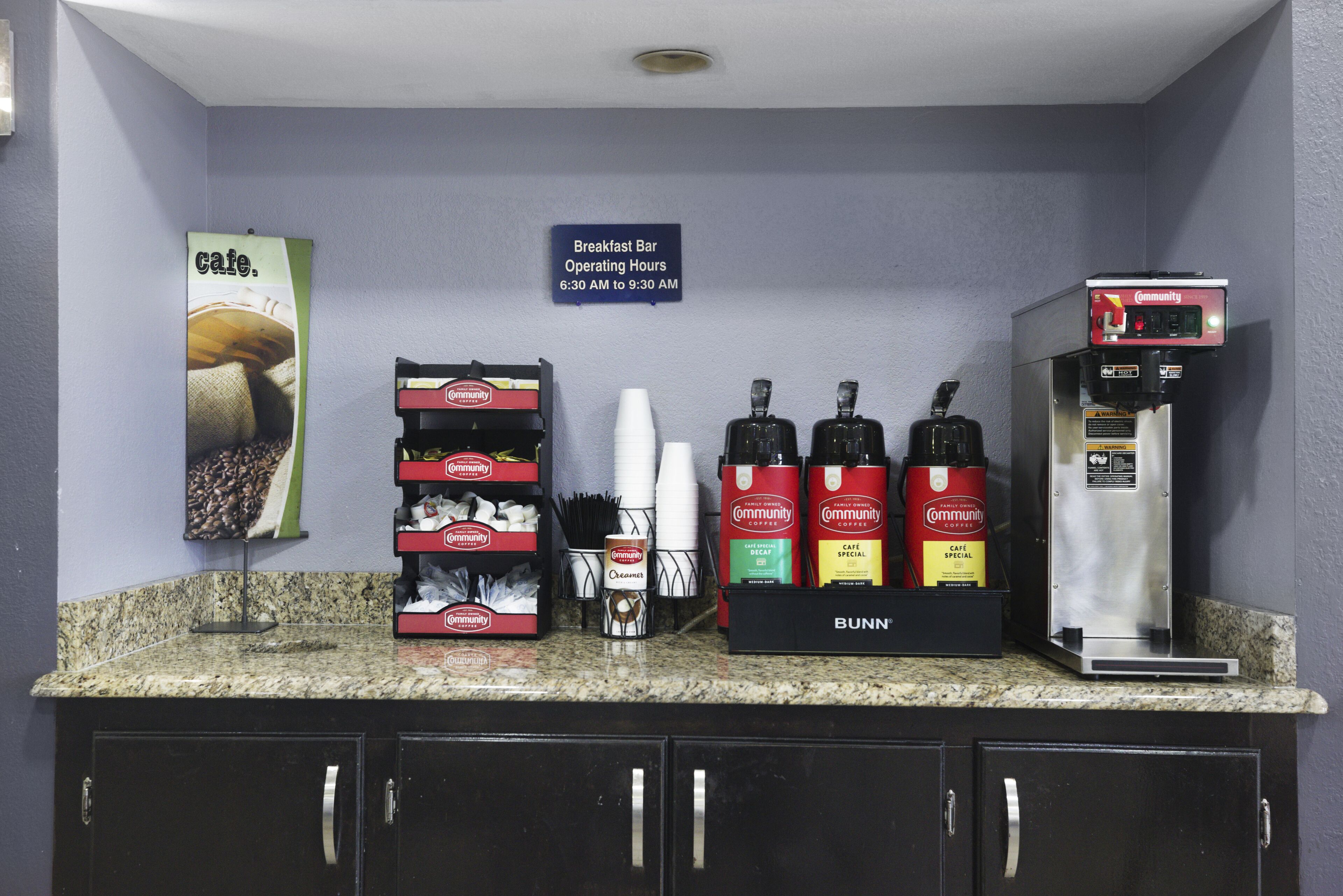 A breakfast bar with operating hours from 6:30 AM to 9:30 AM, coffee machines, and coffee pods labeled 'Community'.