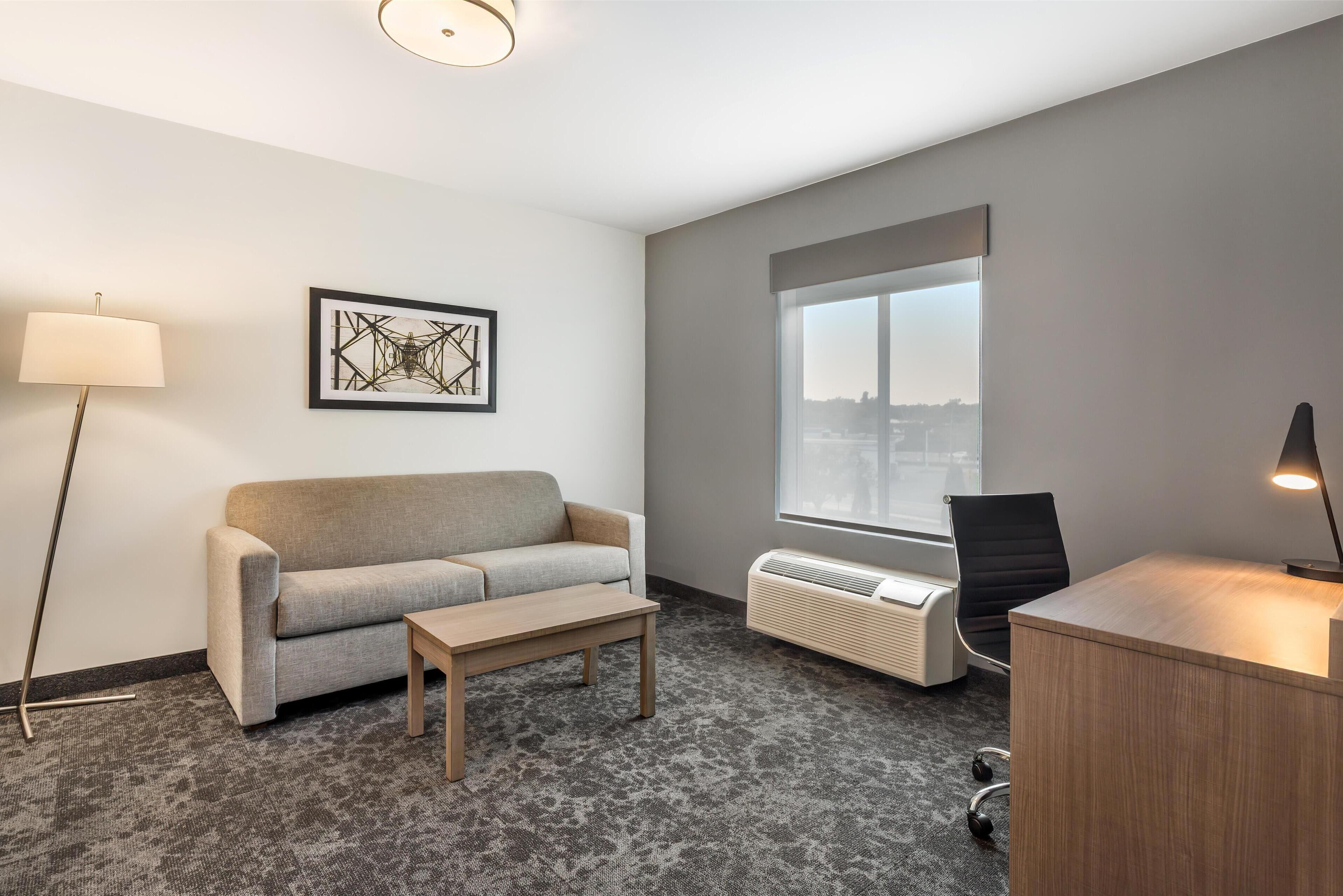 Suite, 1 King Bed, Non Smoking (with Single Sofabed) | Desk, laptop workspace, soundproofing, rollaway beds