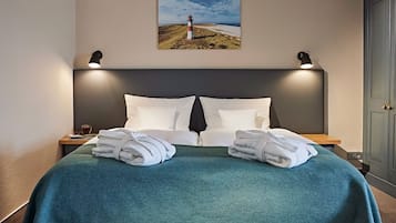 Hypoallergeen beddengoed, een minibar, een kluis op de kamer, een bureau