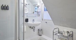 Shower, eco-friendly toiletries, hair dryer, towels