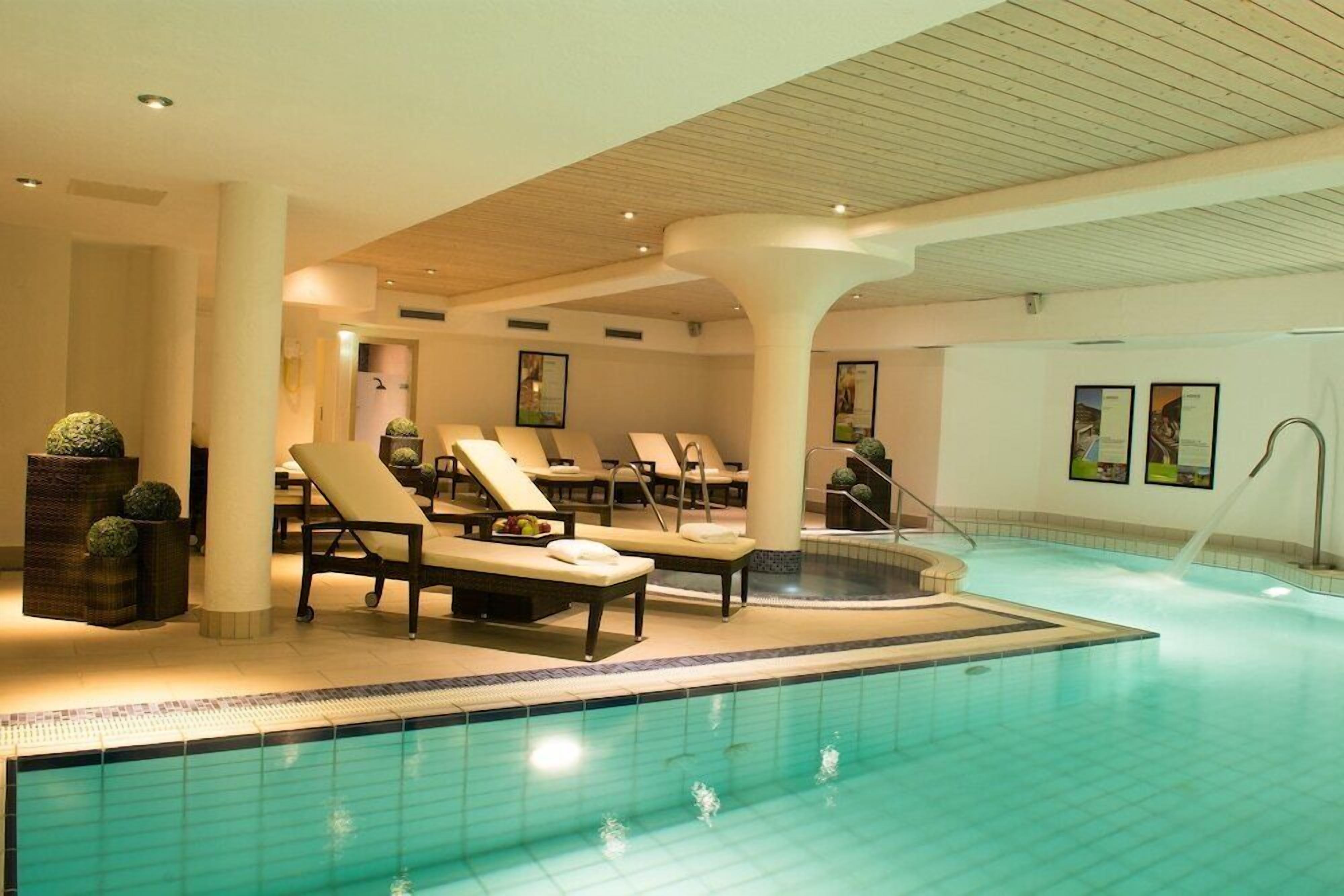 Indoor pool, outdoor pool, open 7:00 AM to 10:00 PM, pool loungers