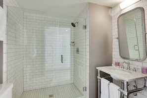 Suite, 1 Bedroom, Pool View | Bathroom | Shower, designer toiletries, hair dryer, bathrobes