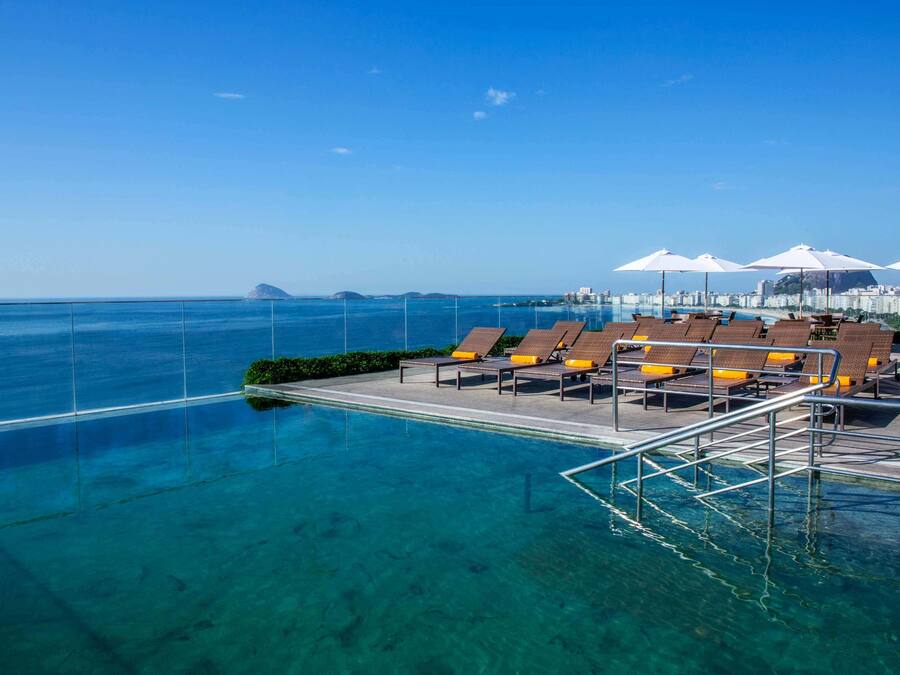Outdoor pool, open 8 AM to 8 PM, pool umbrellas, sun loungers