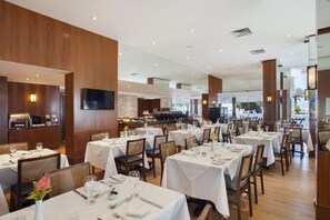 Breakfast, lunch, dinner served; international cuisine, beach views 
