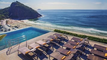 Outdoor pool, open 8 AM to 8 PM, pool umbrellas, sun loungers