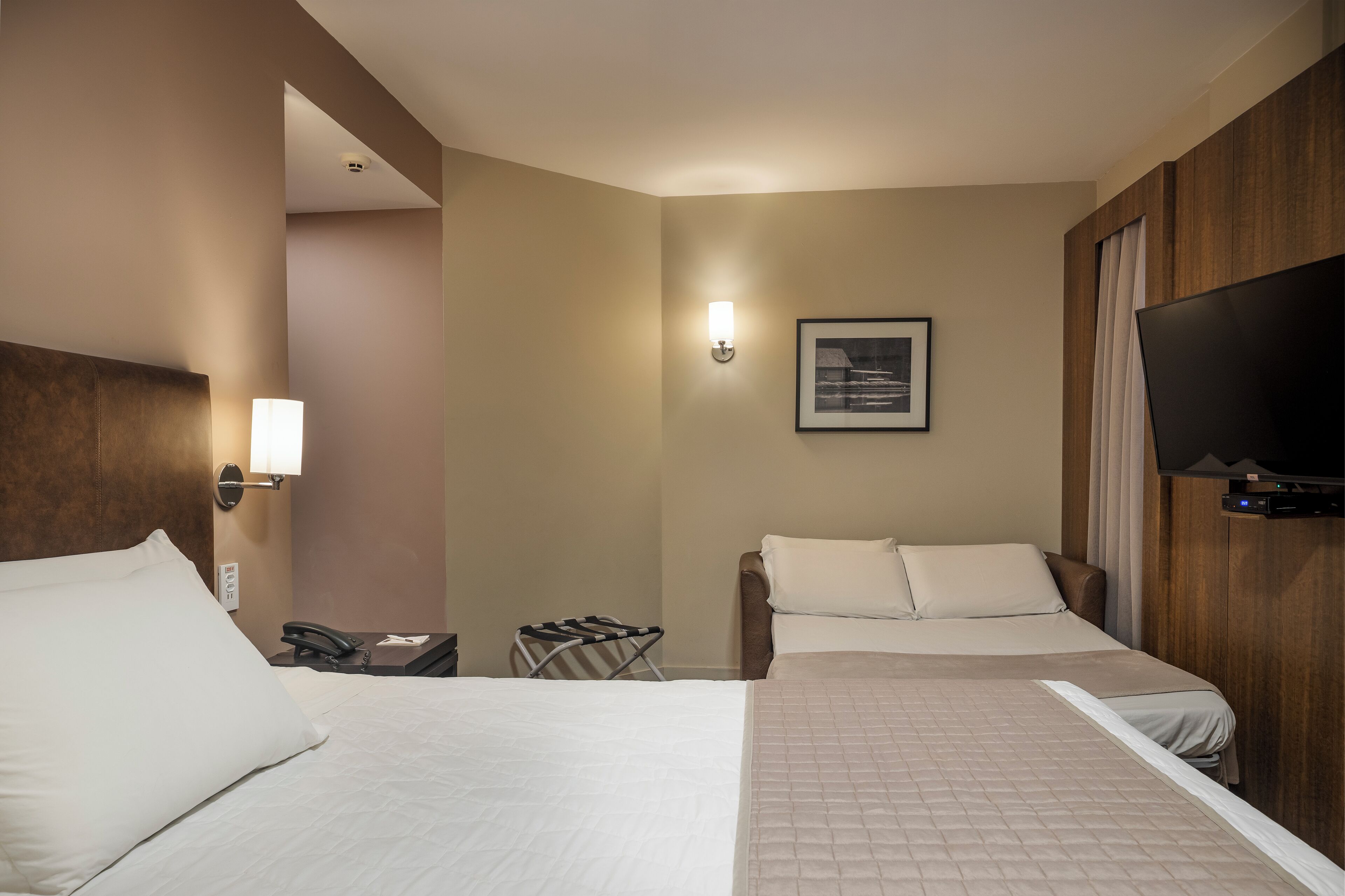 deluxe room, 1 king bed with sofa bed, city view | 1 bedroom, minibar, in-room safe, desk