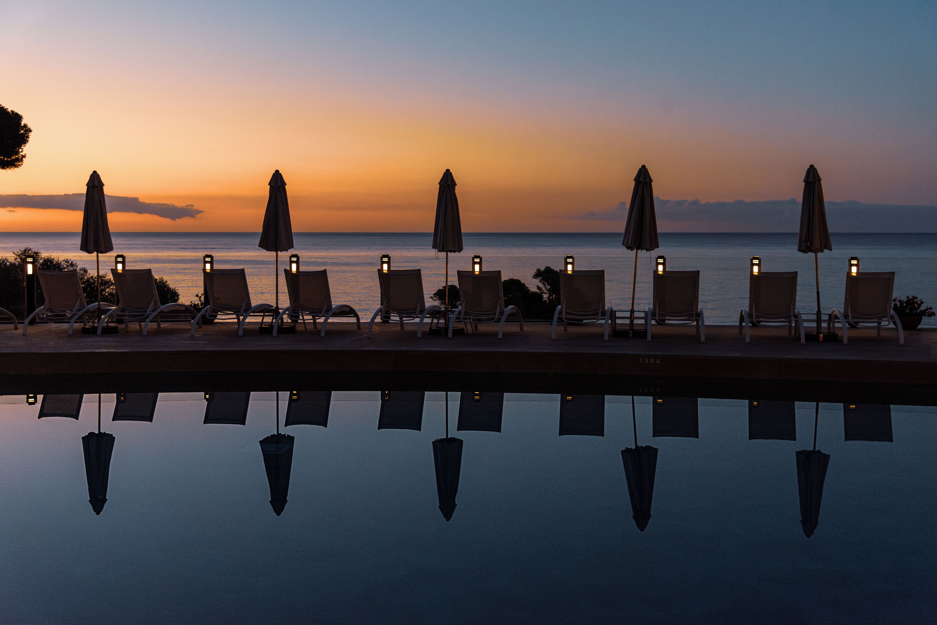 outdoor pool, open 10:00 am to 5:00 pm, pool umbrellas, pool loungers