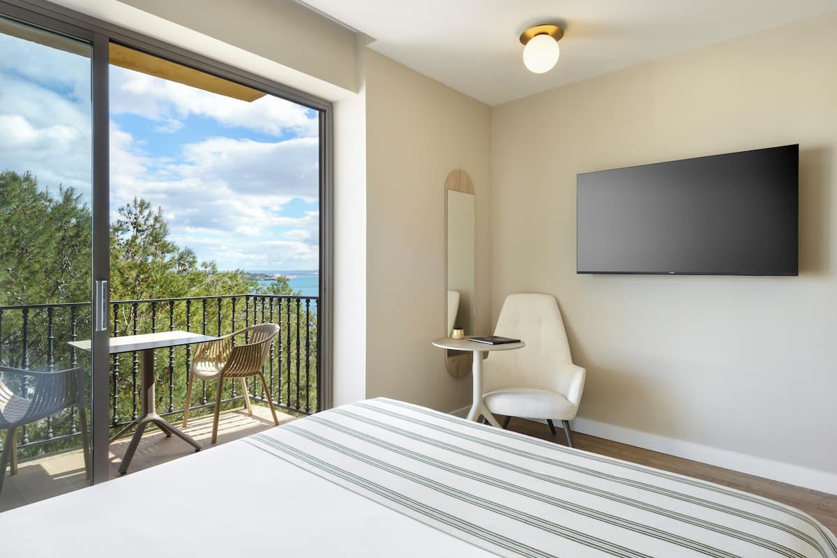 Superior Room, Partial Sea View | In-room safe, laptop workspace, blackout drapes, iron/ironing board