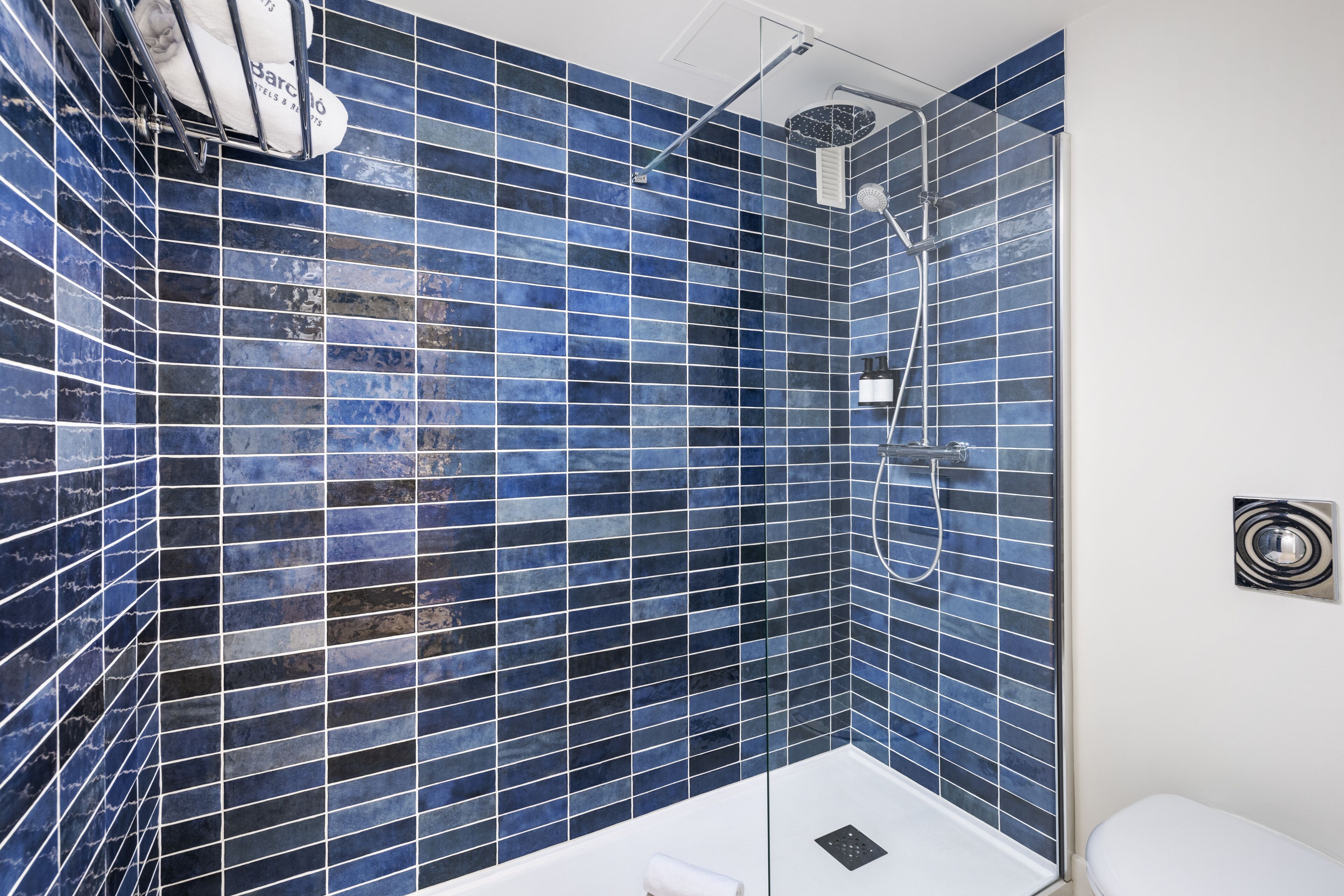 shower, rainfall showerhead, hair dryer, towels