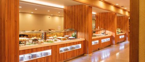 A buffet area with wooden counters and a tiled floor.