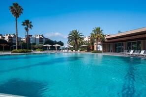 Seasonal outdoor pool, pool umbrellas, pool loungers