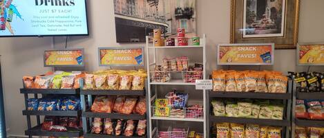 A snack and drink section with various brands like Lay's, Doritos, and Tostitos.