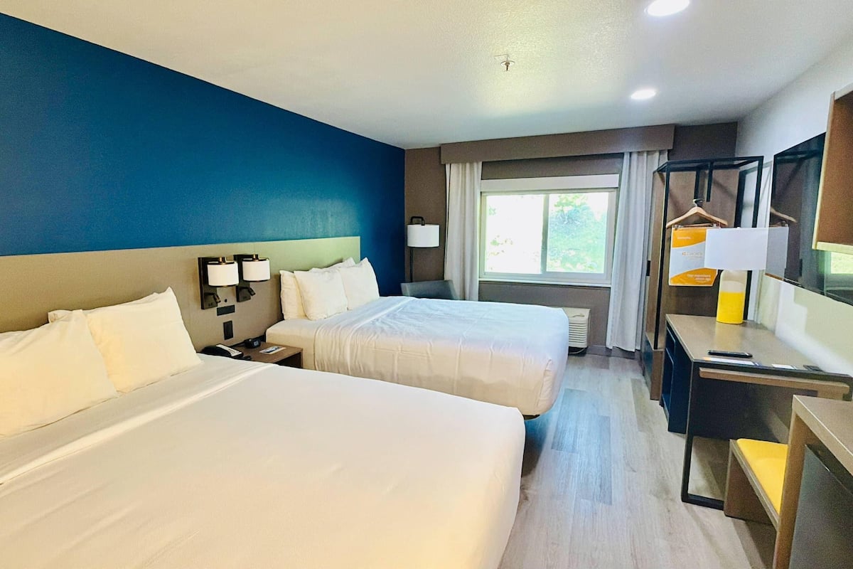 Room, 2 Queen Beds, Non Smoking (Upgrade) | Premium bedding, pillowtop beds, blackout drapes, iron/ironing board