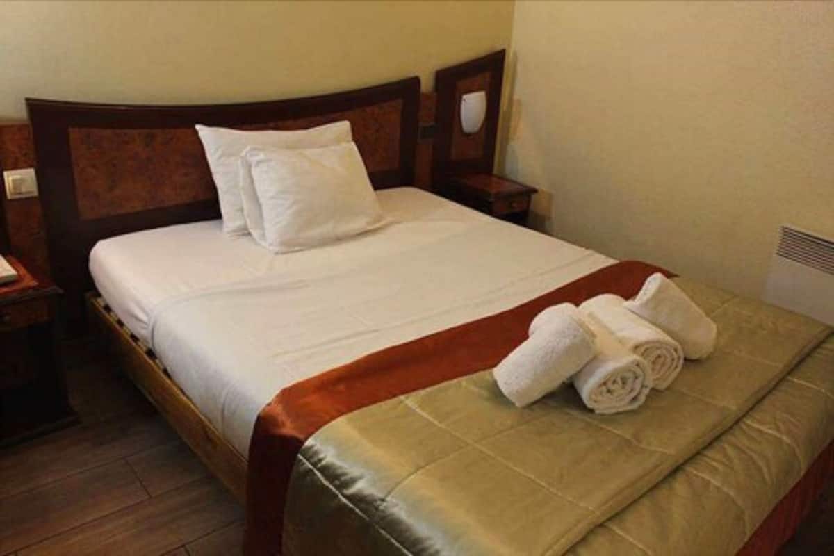 Desk, blackout drapes, bed sheets