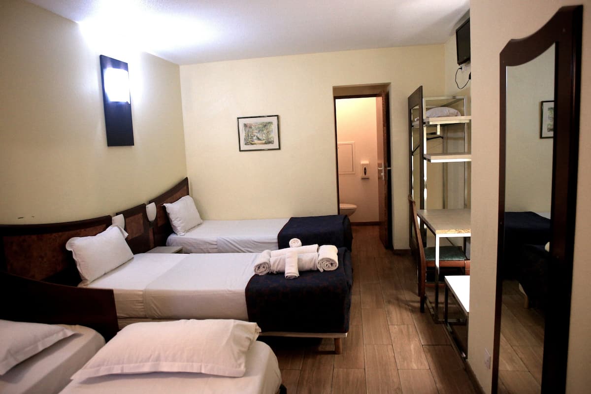 Family Room | Desk, blackout drapes, bed sheets