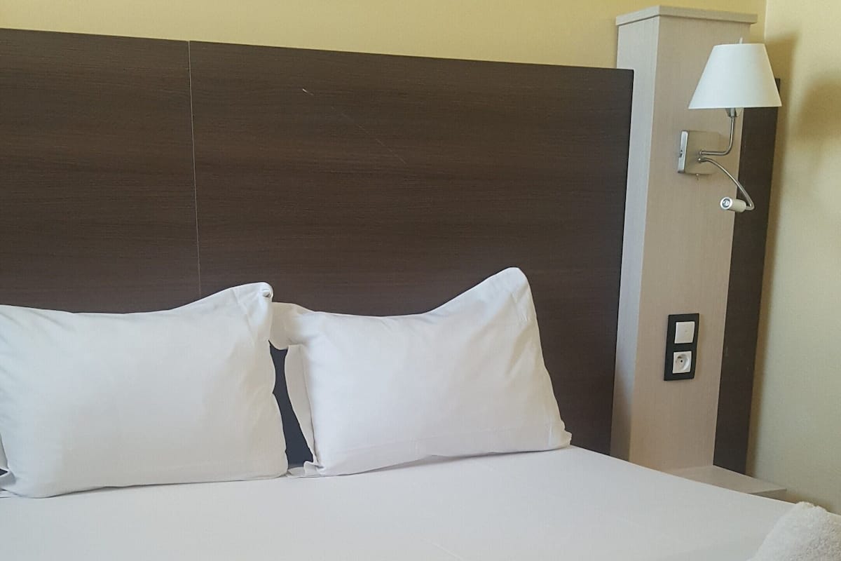 Desk, blackout drapes, bed sheets