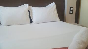 Desk, blackout drapes, bed sheets