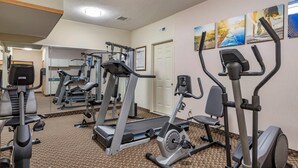 A gym with treadmills, elliptical machines, and weight equipment. - Comfort Inn Charlotte (Charlotte)