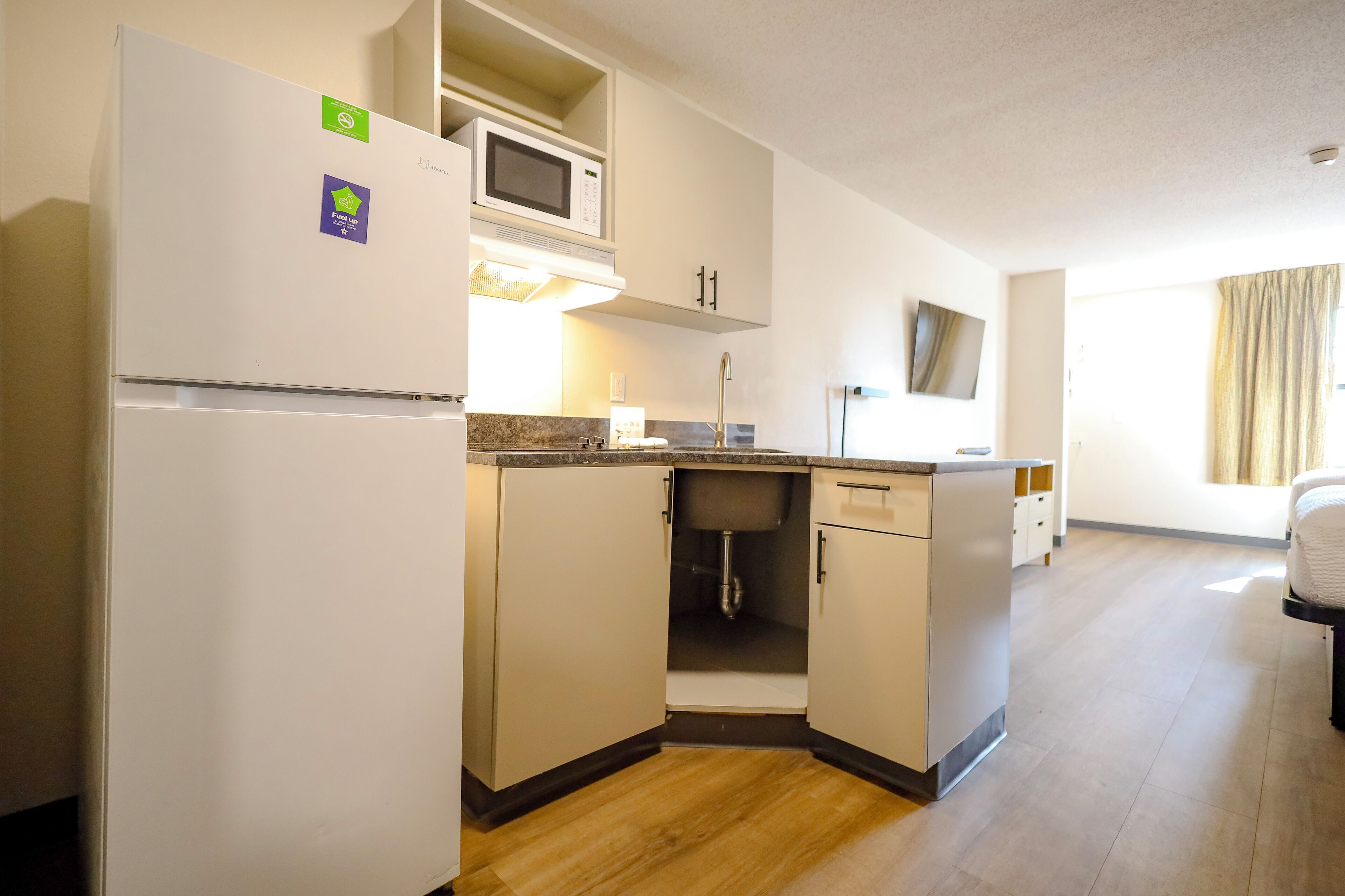 Fridge, microwave, stovetop, coffee/tea maker