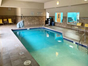 Indoor pool, open 7 AM to 11 PM, pool loungers