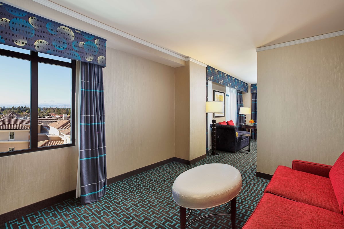 Junior Suite, 1 King Bed, Non Smoking | Living area | Flat-screen TV, iPod dock, pay films