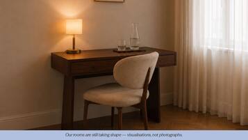 Luxe beddengoed, donzen dekbedden, pillowtop-bedden, een laptopwerkplek