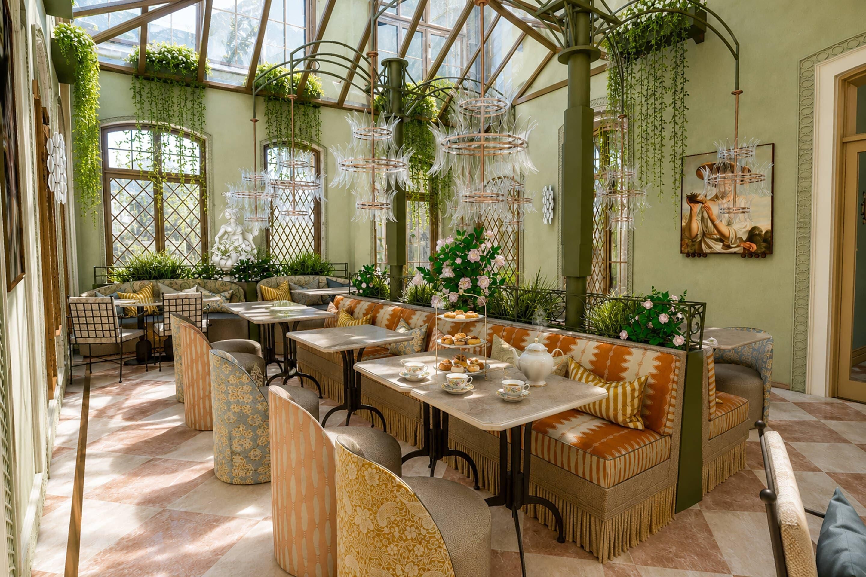 A conservatory with seating, tables, and hanging plants.
