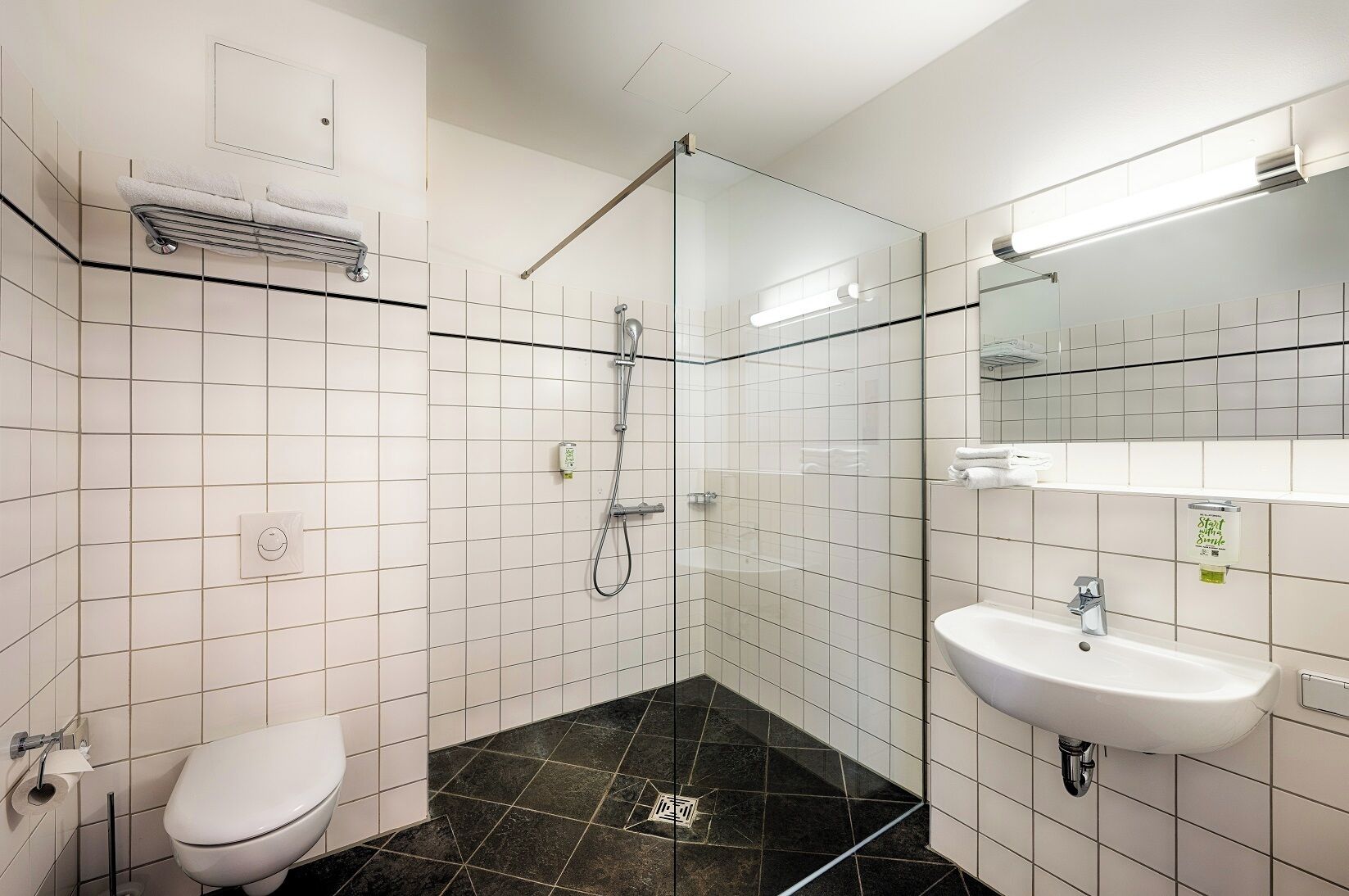 standard double room | bathroom | shower, hair dryer, towels, soap