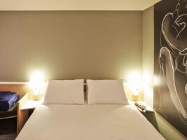 Premium bedding, desk, laptop workspace, blackout drapes