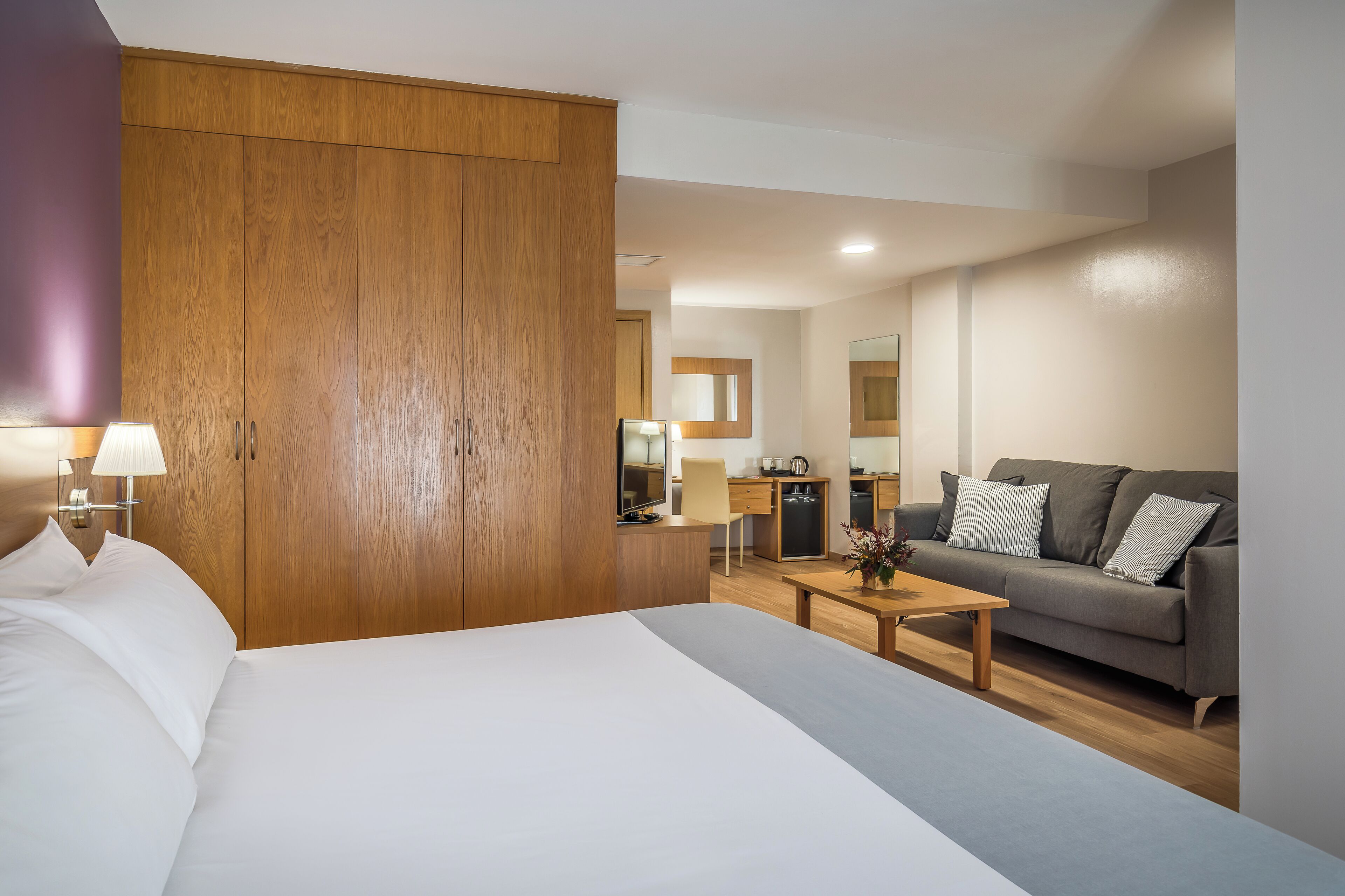 family room | minibar, in-room safe, desk, iron/ironing board