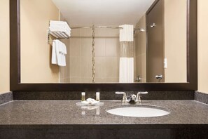 Combined shower/bathtub, designer toiletries, hair dryer, towels