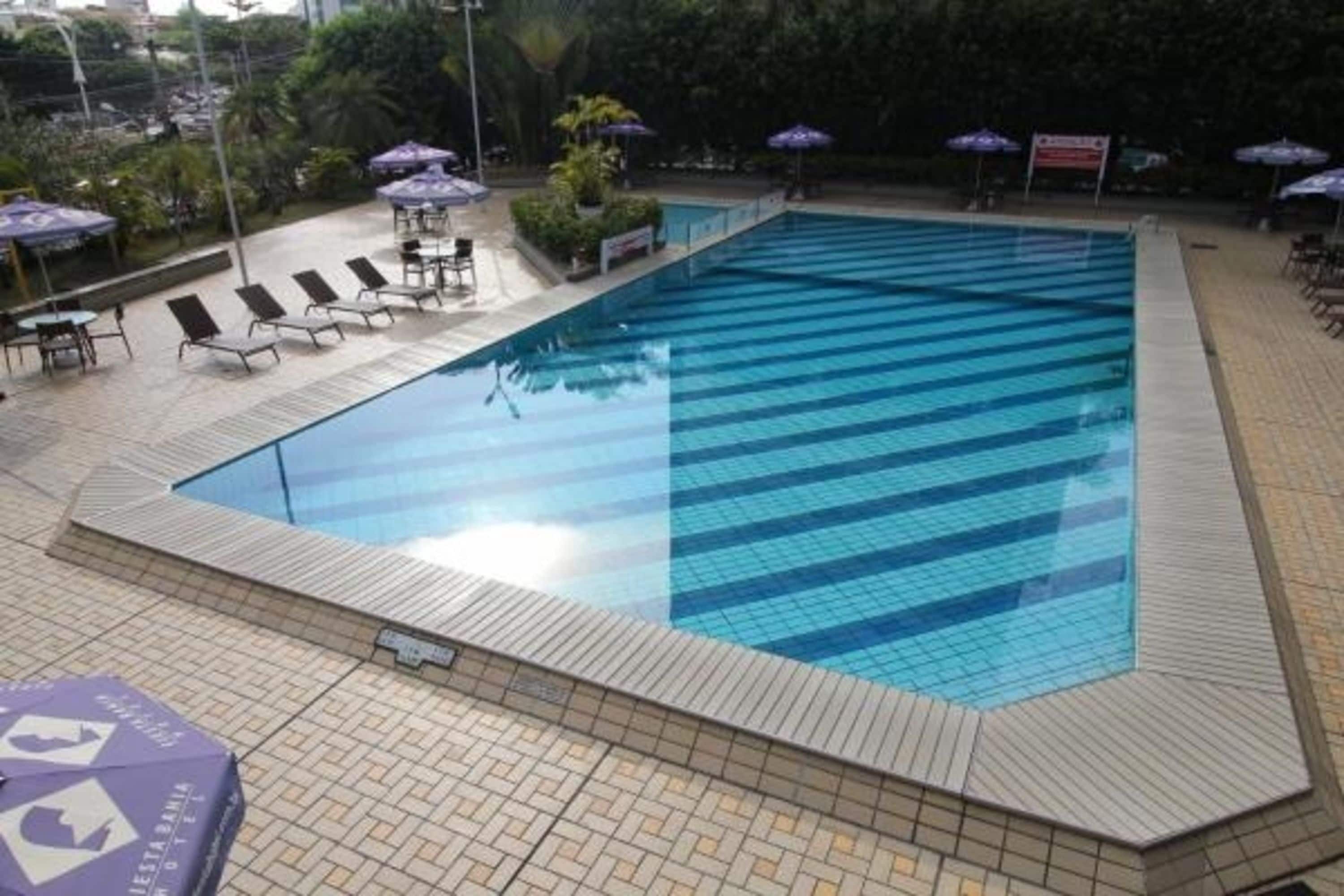 outdoor pool, open 9:00 am to 6:00 pm, pool umbrellas, pool loungers