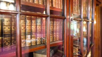 A wooden bookshelf filled with books.