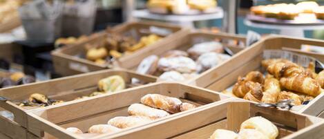 Wooden trays filled with various pastries and baked goods.