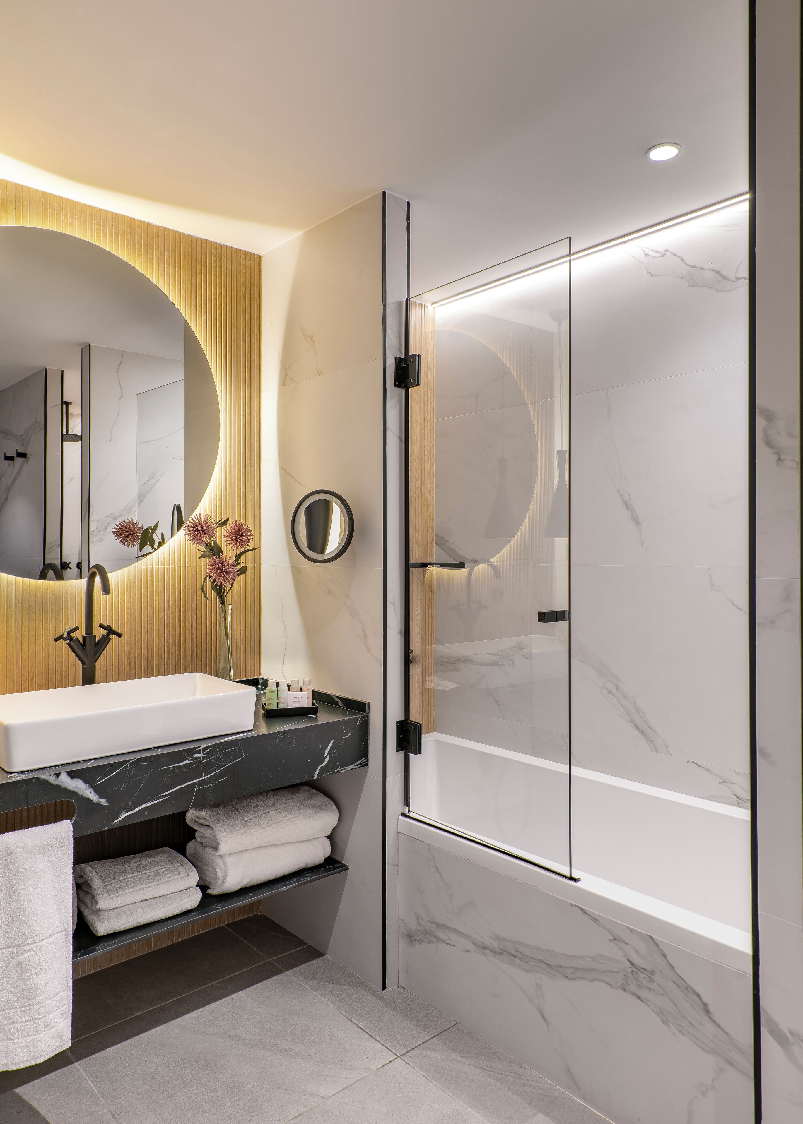 shower, designer toiletries, hair dryer, towels