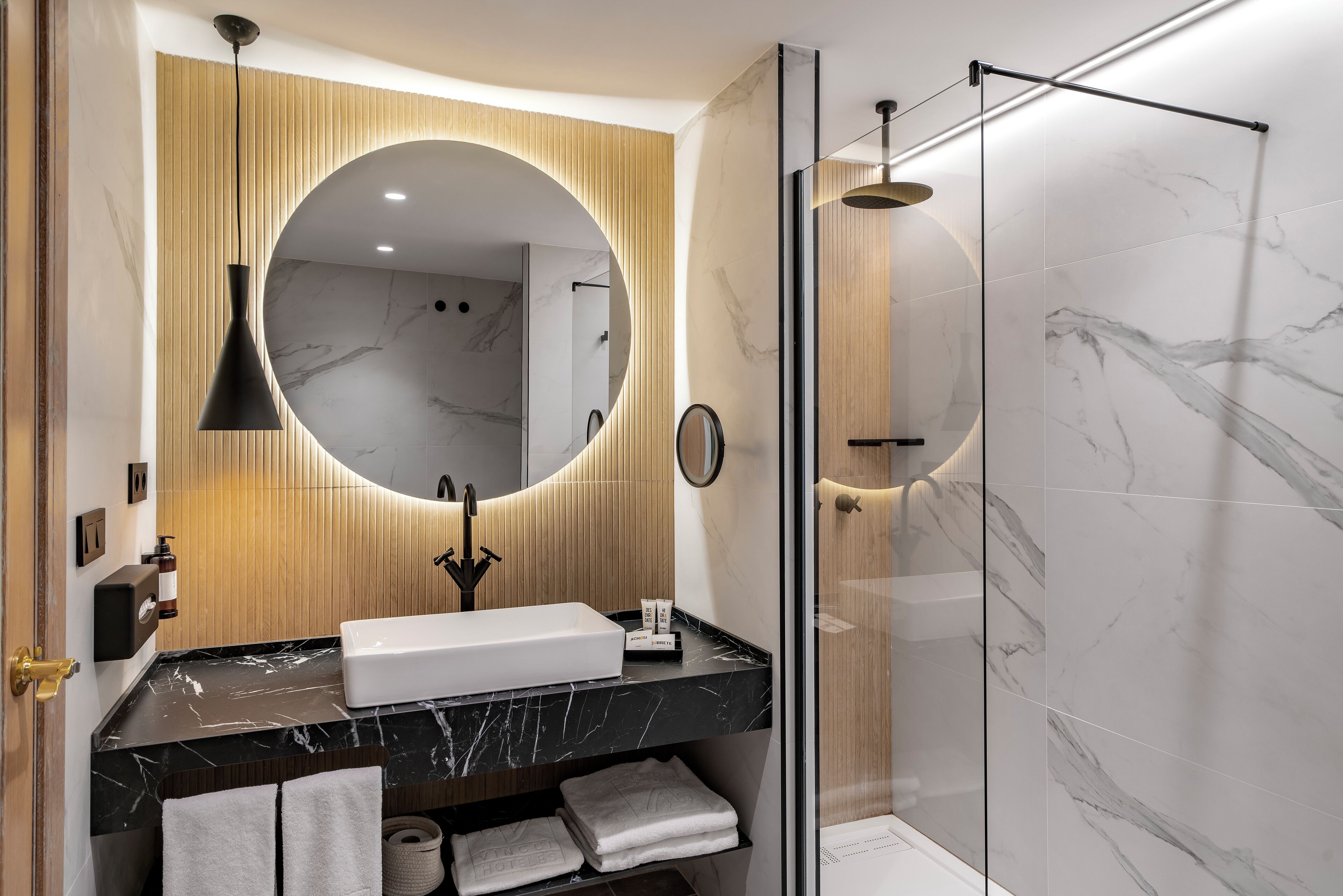 shower, designer toiletries, hair dryer, towels