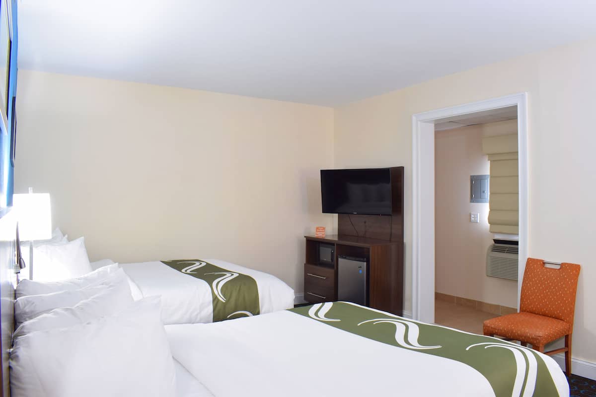 Premium bedding, desk, iron/ironing board, free cribs/infant beds
