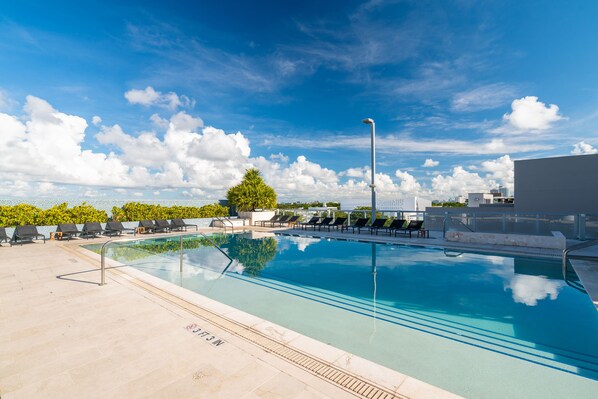 Outdoor pool, open 7:30 AM to 8 PM, pool cabanas (surcharge)