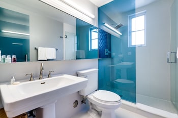 Shower, rainfall showerhead, designer toiletries, hair dryer at South Beach Hotel
