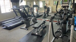 A gym with treadmills, elliptical machines, and weight equipment. - Staybridge Suites Chicago-Oakbrook Terrace by IHG (Villa Park)
