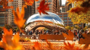 A large, reflective sculpture surrounded by a crowd of people in an urban park setting. - Staybridge Suites Chicago-Oakbrook Terrace by IHG (Villa Park)