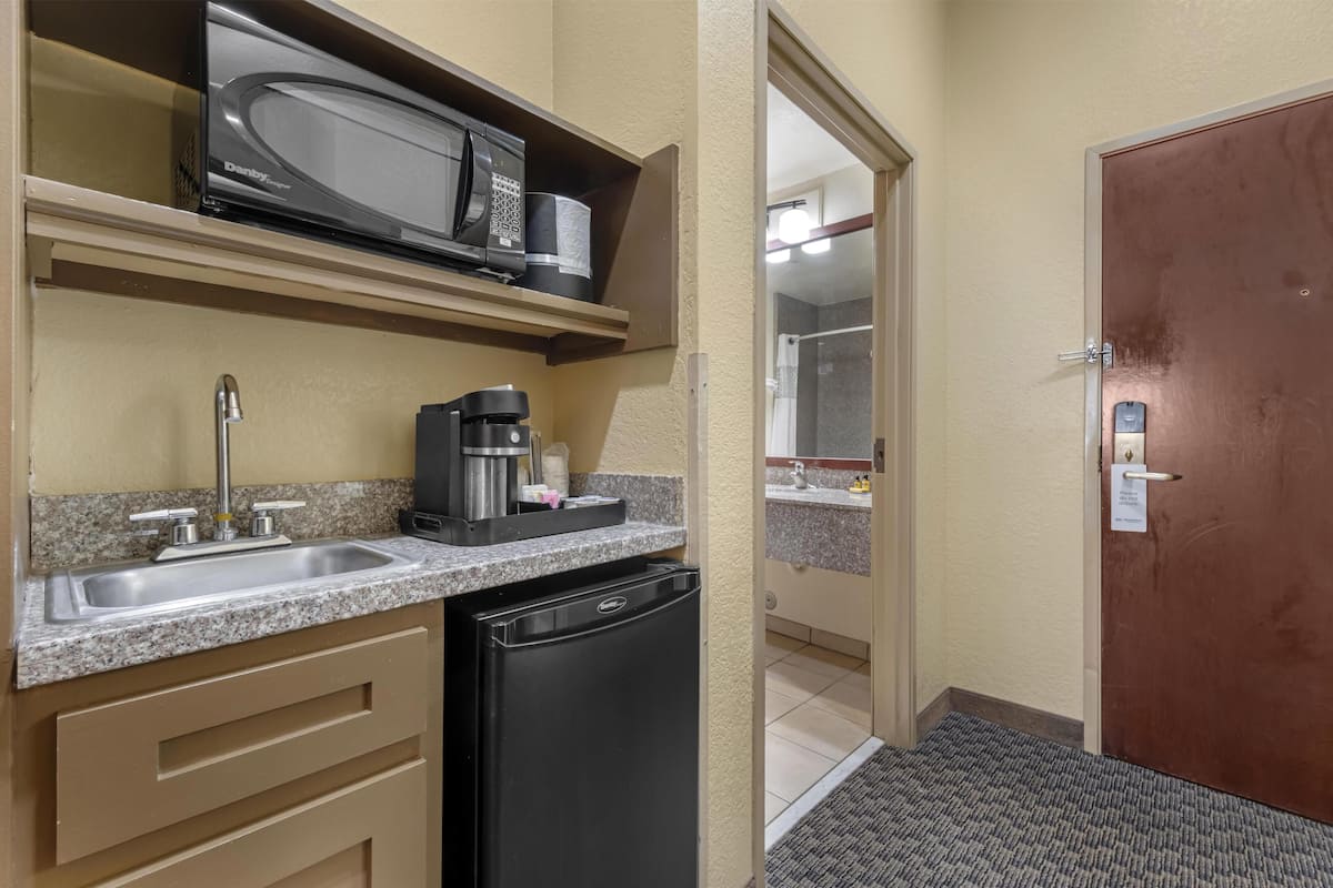 Desk, laptop workspace, iron/ironing board, cots/infant beds