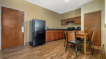 Suite, 1 King Bed, Non Smoking, Jetted Tub | Desk, laptop workspace, iron/ironing board, cribs/infant beds