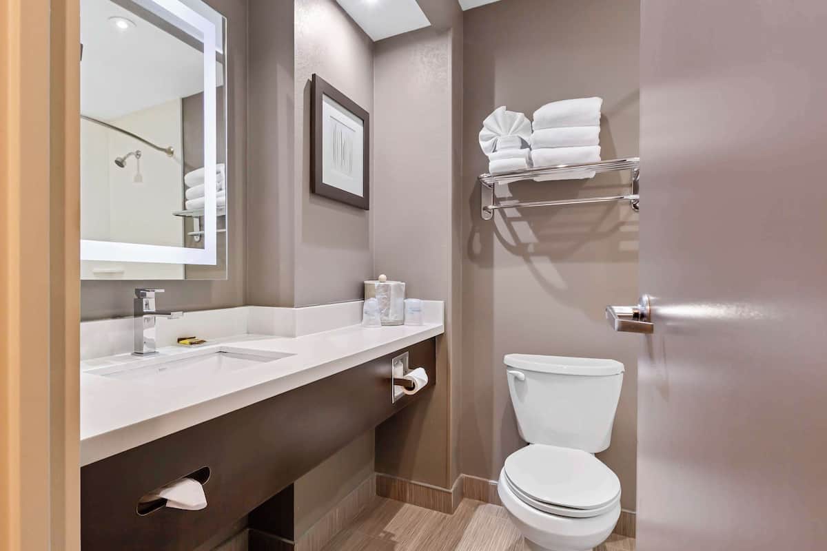 executive room, 2 queen beds, non smoking, refrigerator & microwave (with sofabed) | bathroom | rainfall showerhead, free toiletries, hair dryer, towels