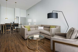 Suite, 1 Bedroom | Living area | 55-inch flat-screen TV with cable channels, TV