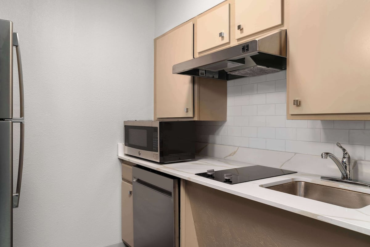 full-sized fridge, microwave, stovetop, dishwasher