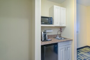 A compact kitchen with a microwave, coffee maker, and dishwasher. - Holiday Inn Express Hotel & Suites Easton by IHG (Easton)